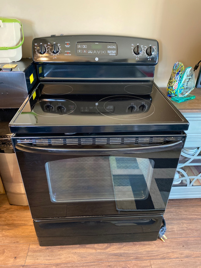 GE Glass top self cleaning stove Very good condition All elements