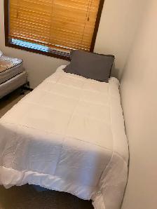 MOVING SALE TWO TWIN BEDS WITH BRAND NEW BEDDING