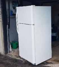 White full size Frigidaire fridge with freezer