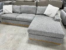 Grey fabric sectional with oversized chaise