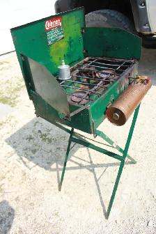 Vintage Coleman camp stove on stand