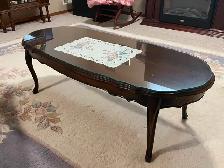 wooden coffee table with glass top