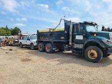 Tandem dump truck driver for manual
