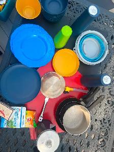 Camping necessities: plates, bowls, coffee pot,water pail