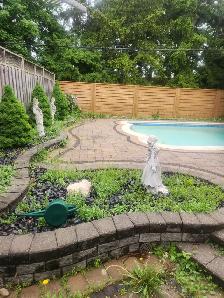 Weeds to be removed from stone deck and gardens.