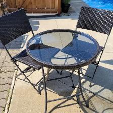 Small outdoor table with two chairs