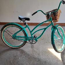 Ladies Hyper Neon Teal Cruiser bike for sale.