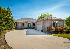 Custom 3-Bdrm Home w/ Sunroom & Triple Garage in East St Paul!