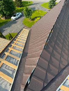 Steel roofer and helper