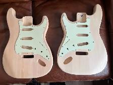 Left and Right Strat style bodies with minty green pickguards