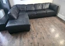 Genuine Leather black sectional with pullout queen matress bed