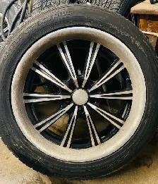 Four Aluminum Rims and Tires