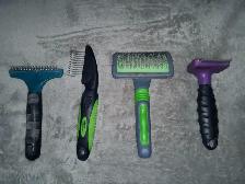 Four Used Dog or Cat Brushes including a Furminator brush