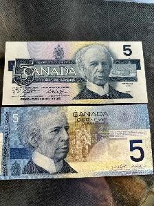 1986   2001 $5 bills with identical serial numbers