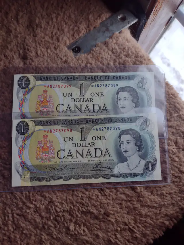 Two unc Canadian 1973 replacement Astrix series $1.00 bills