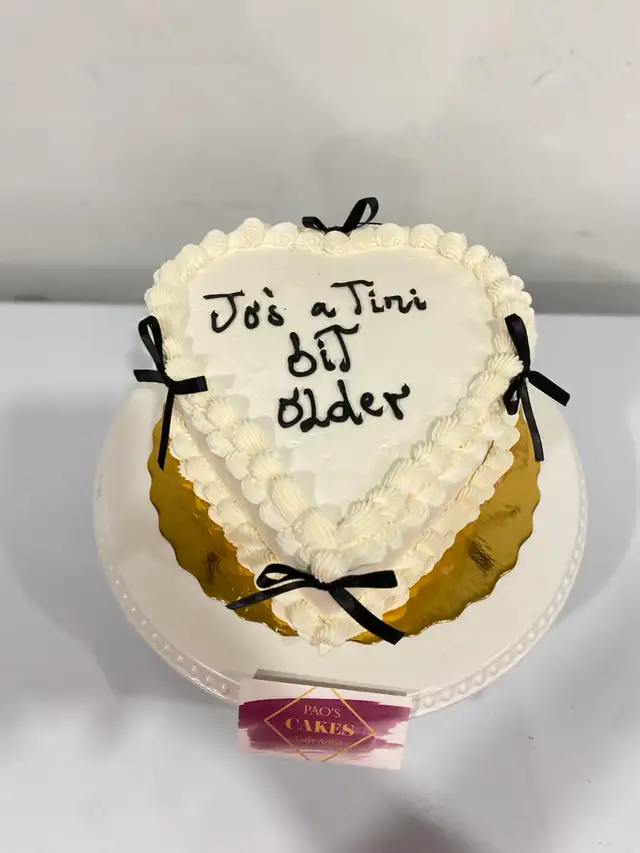 heart vintage cake with mini bows  Milton bakery