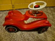 Red Ride-On Bobby Car fir kids with show protectors