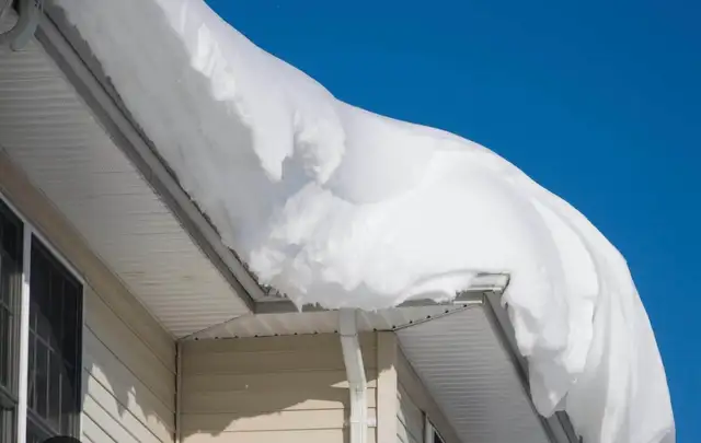 shovelling snow off roofs