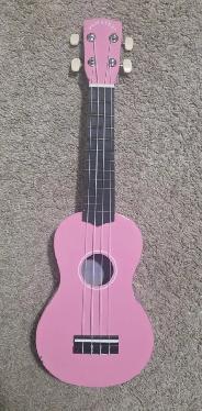 Pink small acoustic toy guitar$20