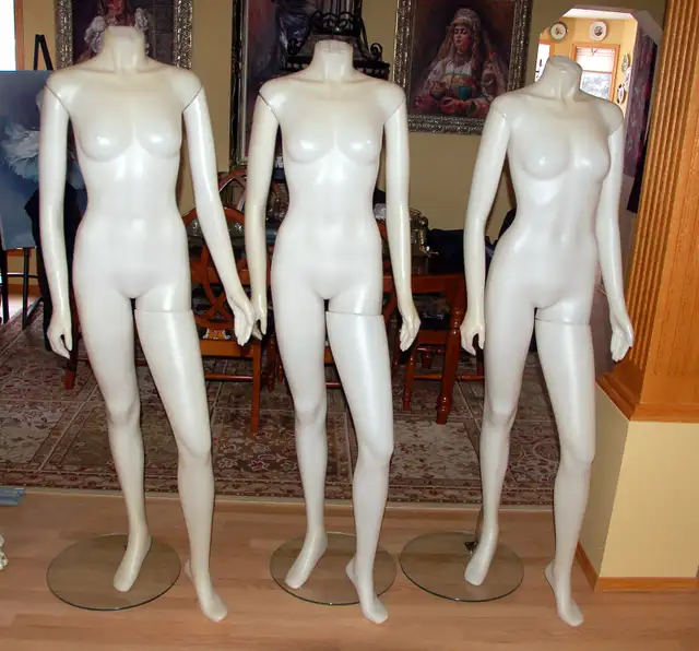 3 identical female  headless mannequin
