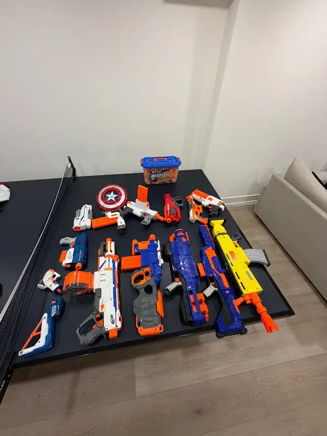 Nerf  toys and box of darts