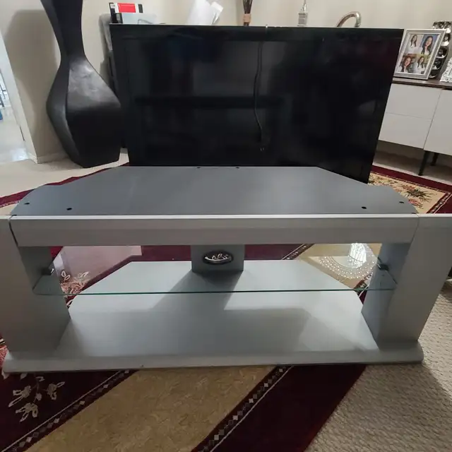 TV stand with glass shelves for $45.00, L 50'× H 18.5
