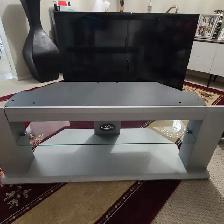 TV stand with glass shelves for $45.00, L 50'× H 18.5