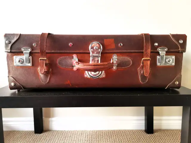 Vintage cowhide suitcase
