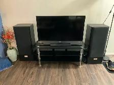 40 Inch Sony LCD TV, stand, and tower speakers