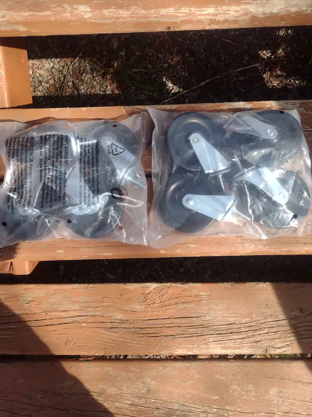 Two sets of 4 casters each set has 2 wheel locks 4' tall new
