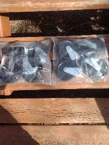 Two sets of 4 casters each set has 2 wheel locks 4' tall new