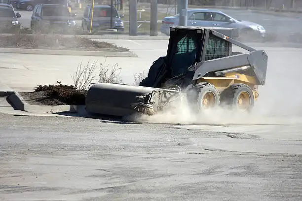 Parking lot gravel cleanup & Sweeping - Photo 2