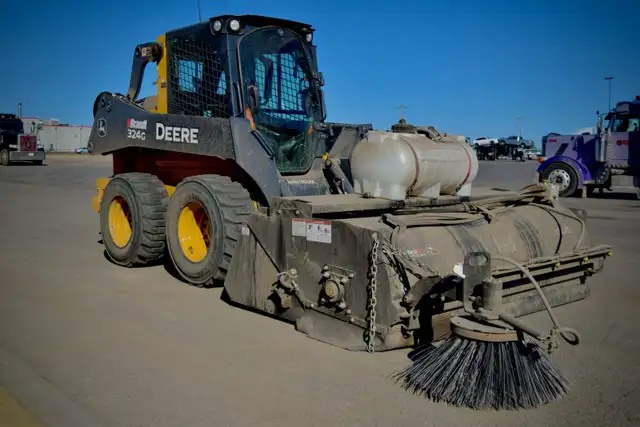 Parking lot gravel cleanup & Sweeping - Photo 3