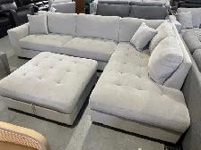 Grey fabric sectional with storage ottoman