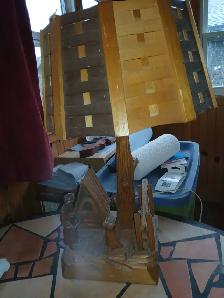 Old carved wooden lamp of a Baker baking bread