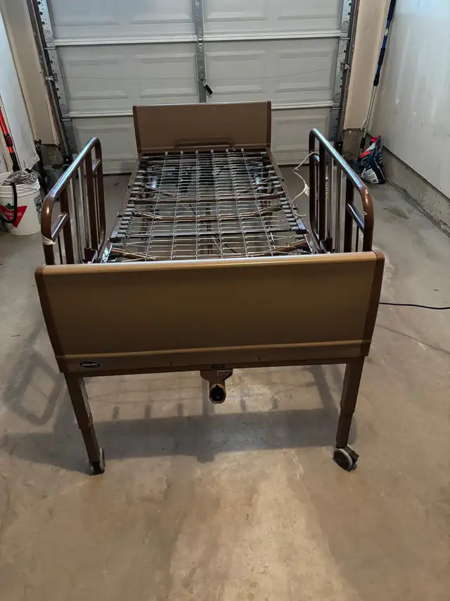 Invacare fully electric Hospital bed with side rails.