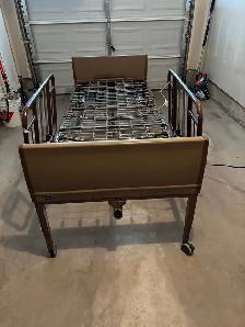 Invacare fully electric Hospital bed with side rails.