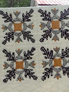 Peach coloured quilt with flowers 75 x 92