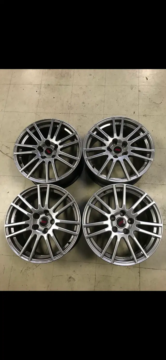 2011 Subaru STI.  18 inch aluminum rims