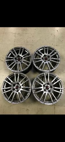 2011 Subaru STI.  18 inch aluminum rims