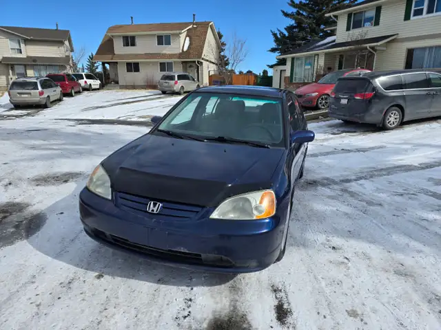Honda civic 2003 standard manual transmission with four doors - Photo 3