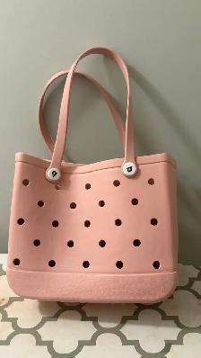 large pink plastic bag / purse