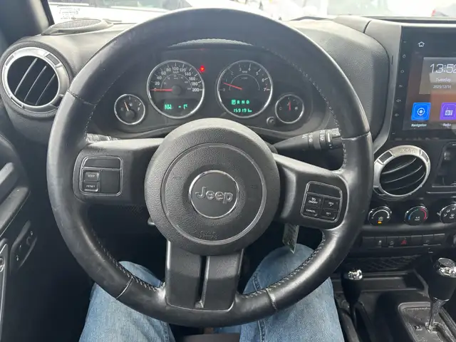 2015 Jeep WRANGLER UNLIMITED 4WD 4dr Sahara - Photo 12