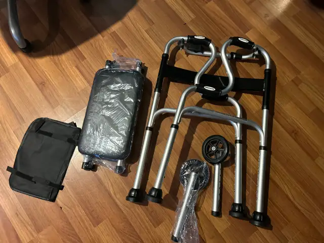 ONE NEW IN THE BOX WHEELED/SEAT ON WALKER