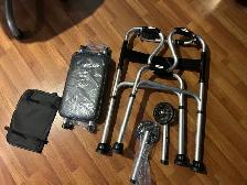 ONE NEW IN THE BOX WHEELED/SEAT ON WALKER