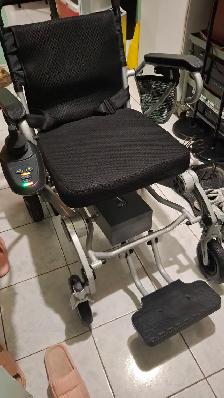 Electric folding wheelchair traveling