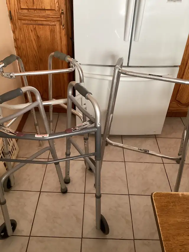 2 folded walkers and 1 free standing walker