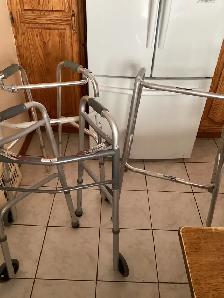 2 folded walkers and 1 free standing walker