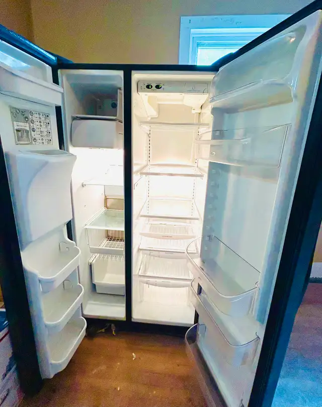 Black large side by fridge for sale, works well