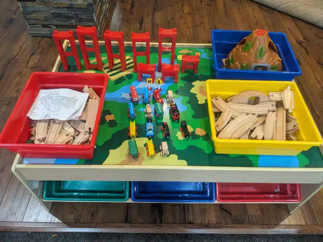 Wooden train set and table with 6 plastic storage bins